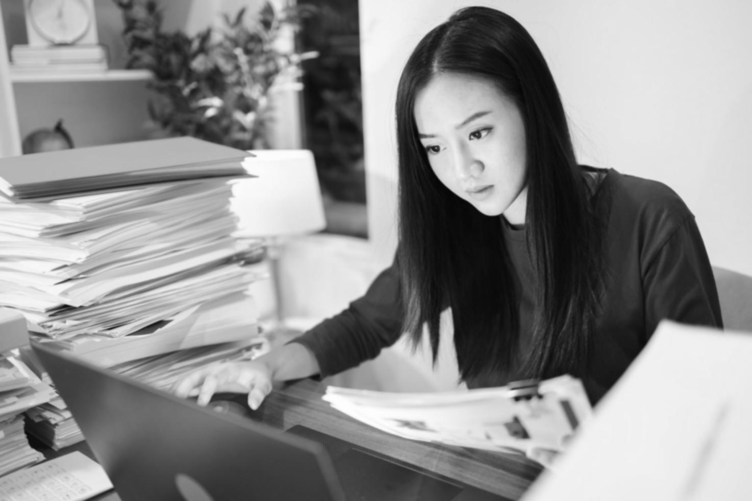 Online learning setup with laptop and notes